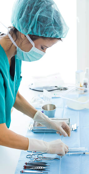 Portrait of doctor with many kind of medical equipment manage for to start operation in operating room 