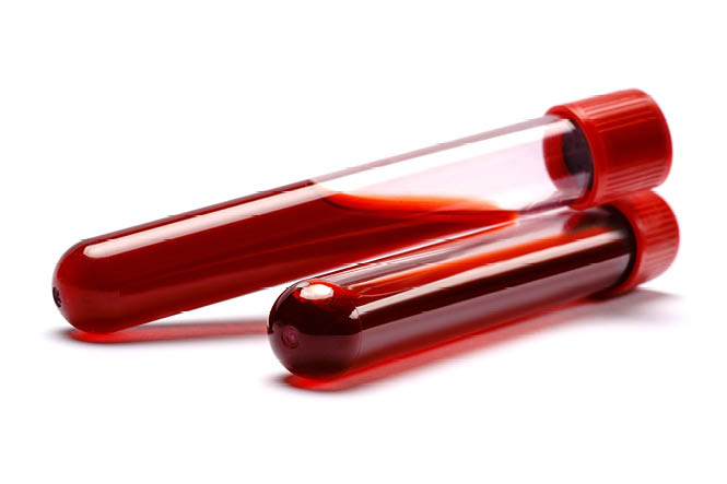 Test tube with red plug isolated on white background 