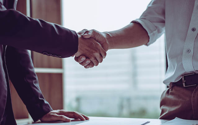 Middle age partner lawyers attorneys shaking hands after discussing a contract agreement done, Asian people 