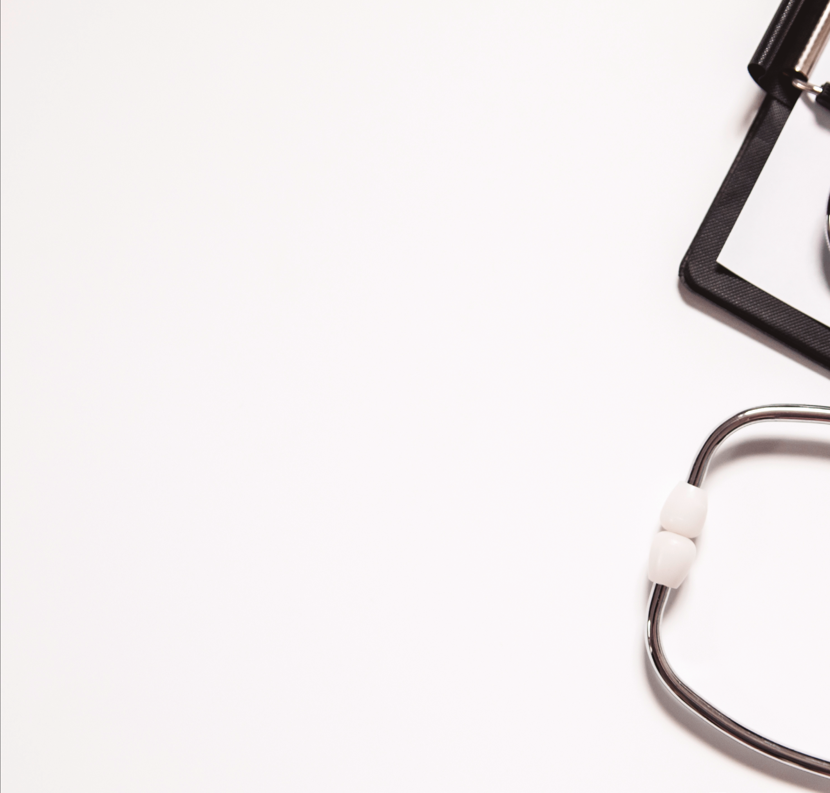 Stethoscope and blank clipboard isolated on white. Stethoscope and clipboard with blank white sheet of paper and copy space. Medical concept