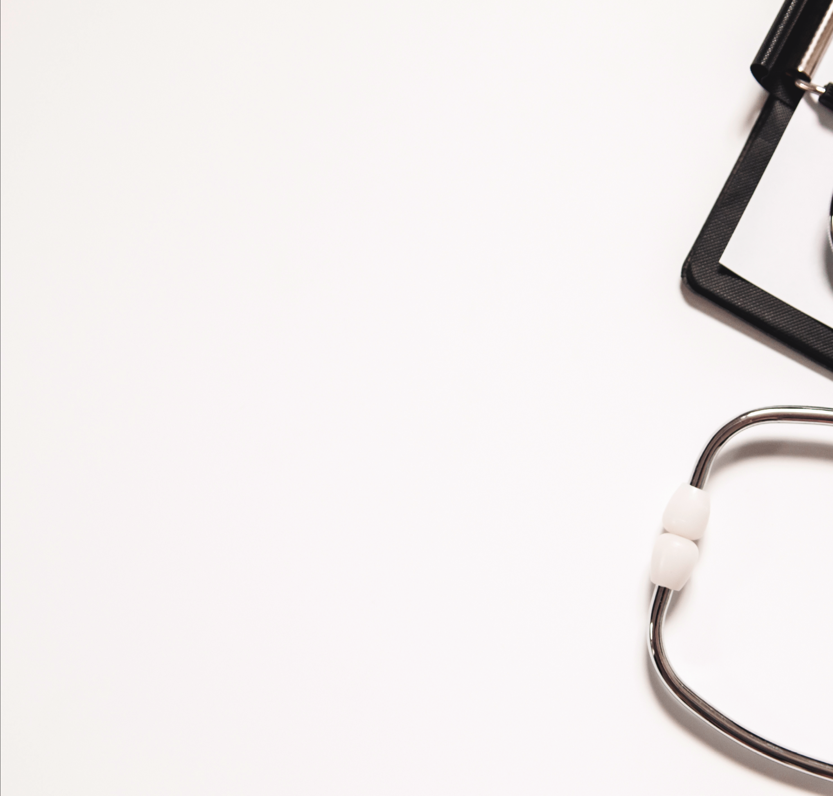 Stethoscope and blank clipboard isolated on white. Stethoscope and clipboard with blank white sheet of paper and copy space. Medical concept