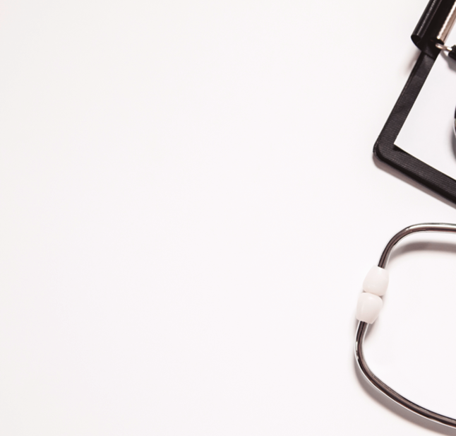 Stethoscope and blank clipboard isolated on white. Stethoscope and clipboard with blank white sheet of paper and copy space. Medical concept