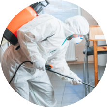 Coronavirus Pandemic  A disinfector in a protective suit and mask sprays disinfectants in house or office  Protection against COVID-19 disease  Prevention of spreding pneumonia virus with surfaces 