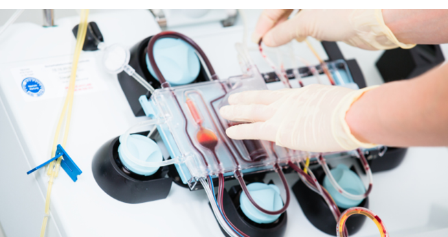 Doctor using Medical device for checking blood during blood donations in hospital
