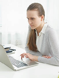 Distance education for students  Quarantine, self-isolation, sociophobia  Young girl listens to online learning, teleworking, online lectures Woman look at laptop  Freelancer, Digital Nomad Concept
