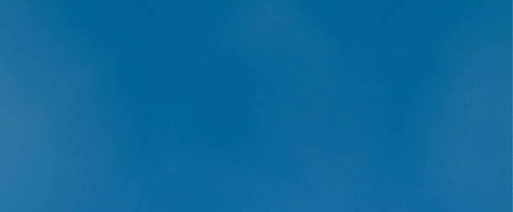 Young Asia girl wear face mask doing stop sing with palm of hand with negative expression and looking at camera  Social distancing, quarantine for corona virus  Panoramic banner blue background 